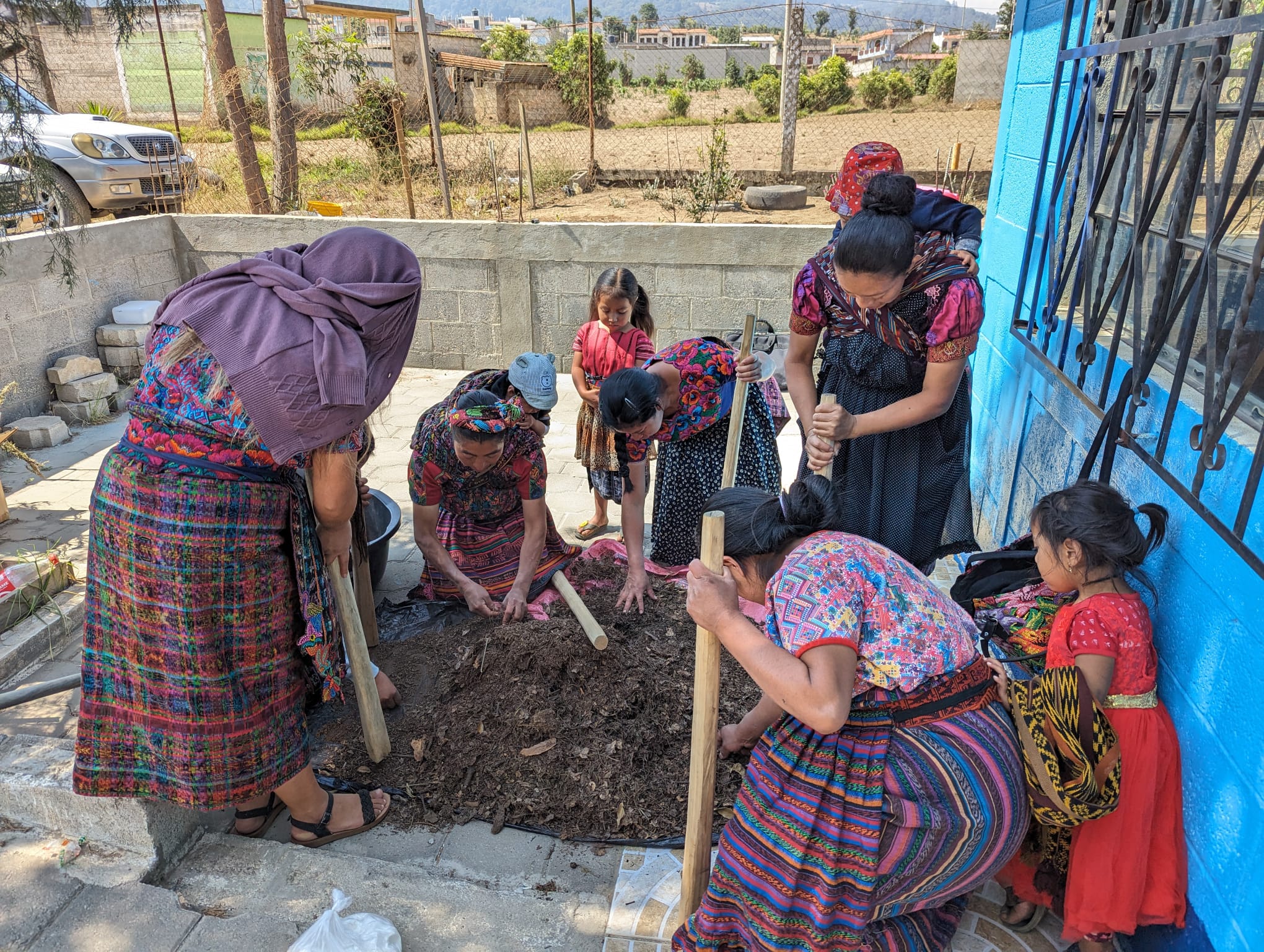 Women learning to produce natural fertiliser at the health post vegetable and medicinal plant garden, Guatemala